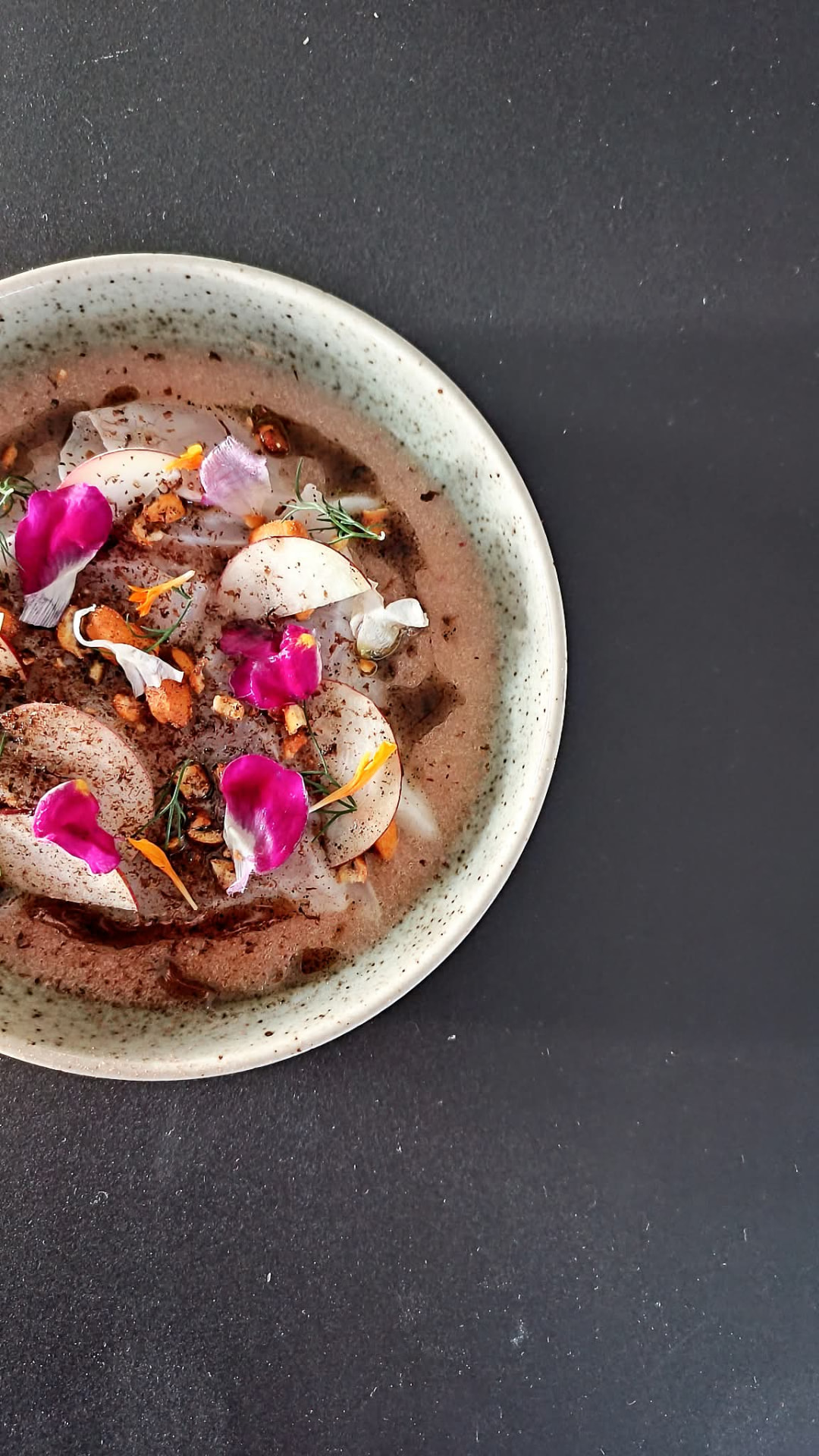 Crudo with rose petals and hazelnut